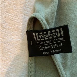 Wolford short sleeved, crew neck bodysuit in grey.